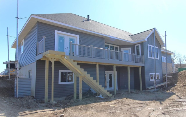 2352 Lonnie Ct, Sun Prairie, WI 53590 - back of property with a wooden deck, stairway, and a shingled roof