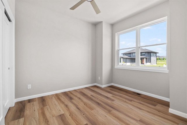 2352 Lonnie Ct, Sun Prairie, WI 53590 - spare room with baseboards, light wood-type flooring, and a ceiling fan