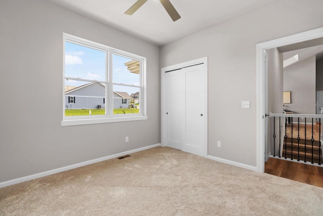 2352 Lonnie Ct, Sun Prairie, WI 53590 - unfurnished bedroom with carpet flooring, baseboards, a closet, and ceiling fan