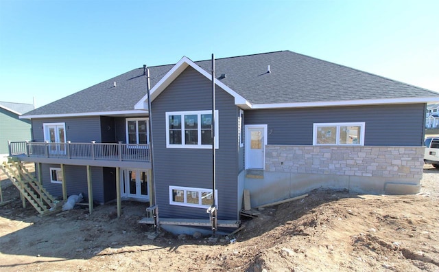 2352 Lonnie Ct, Sun Prairie, WI 53590 - rear view of property with a wooden deck, french doors, roof with shingles, and stone siding