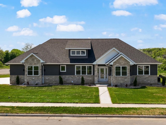 2352 Lonnie Ct, Sun Prairie, WI 53590 - craftsman-style home featuring stone siding, a front yard, and a shingled roof