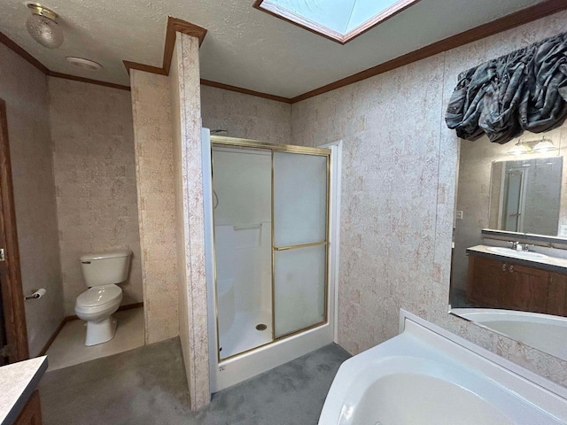 full bathroom featuring a skylight, shower with separate bathtub, vanity, and toilet