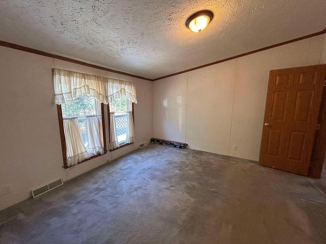 empty room featuring ornamental molding, a textured ceiling, and carpet flooring