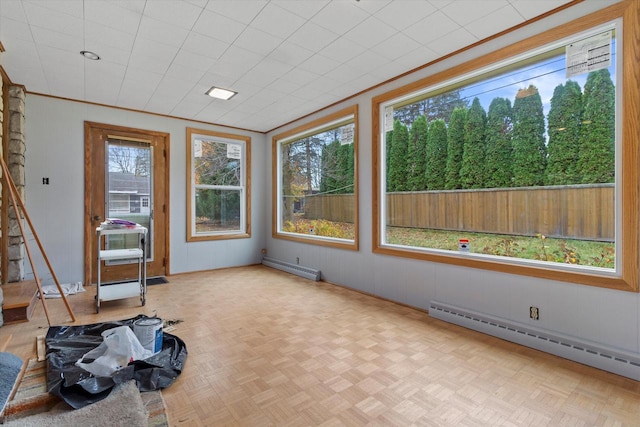 sunroom with a baseboard radiator