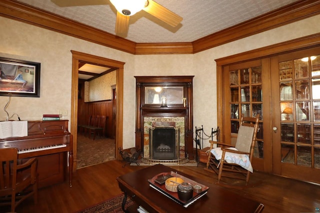 living room featuring ceiling fan, dark wood-type flooring, ornamental molding, and french doors