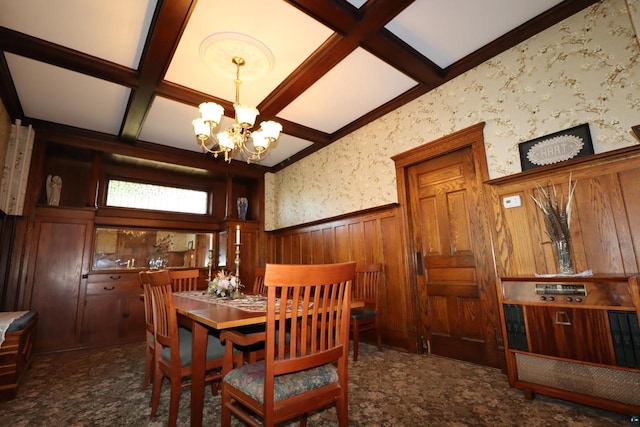 carpeted dining room with coffered ceiling, beam ceiling, and an inviting chandelier