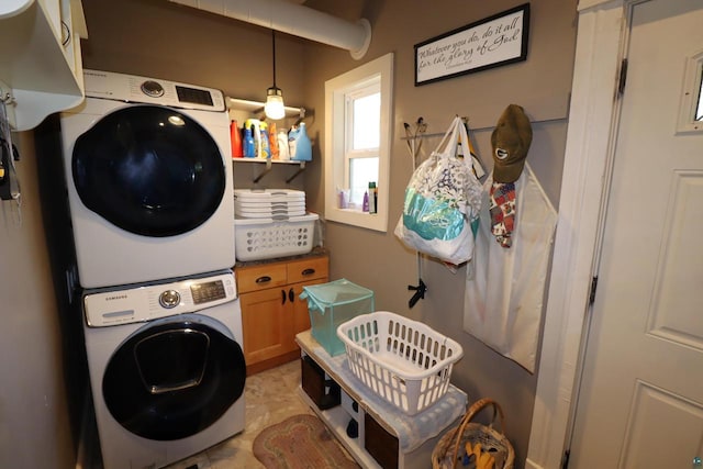 washroom with stacked washer and clothes dryer