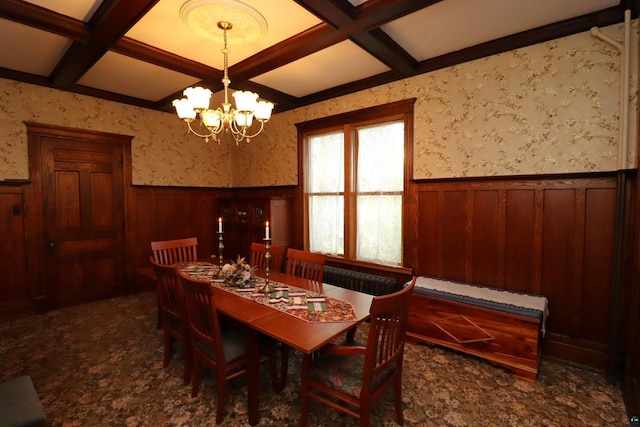 dining area with beamed ceiling, coffered ceiling, and a chandelier