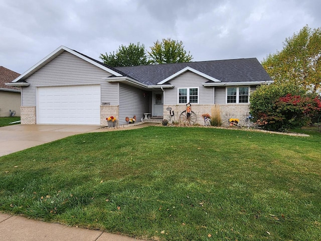 ranch-style home with a garage and a front lawn