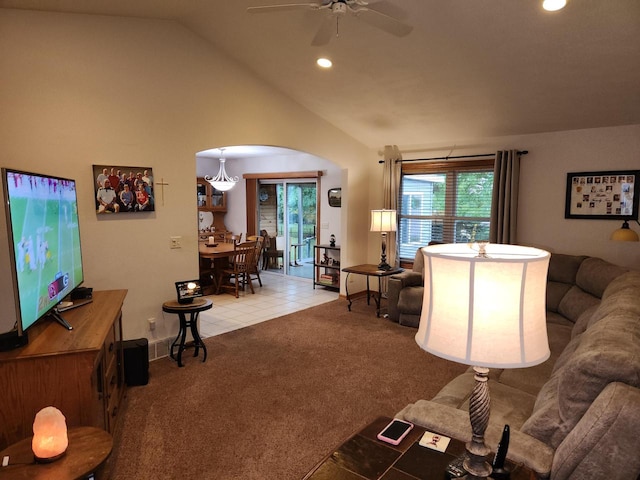 living room featuring ceiling fan, lofted ceiling, and carpet