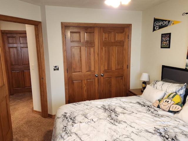 bedroom with carpet floors and a closet