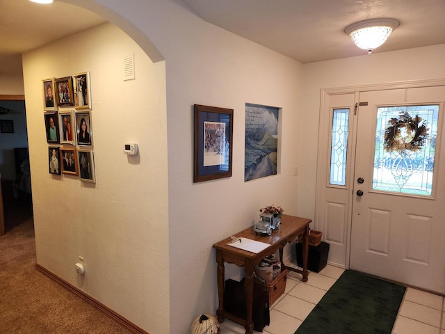 entryway featuring light tile patterned flooring