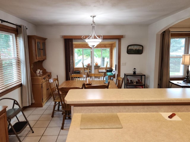 dining room featuring a healthy amount of sunlight and light tile patterned floors