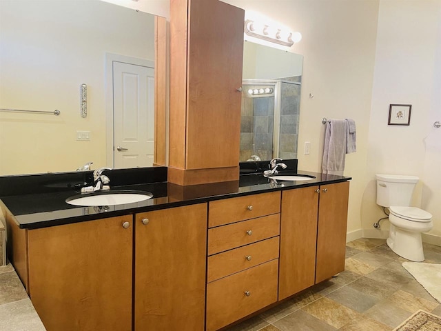 bathroom featuring walk in shower, vanity, and toilet