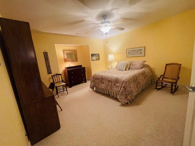 bedroom with ceiling fan and carpet floors