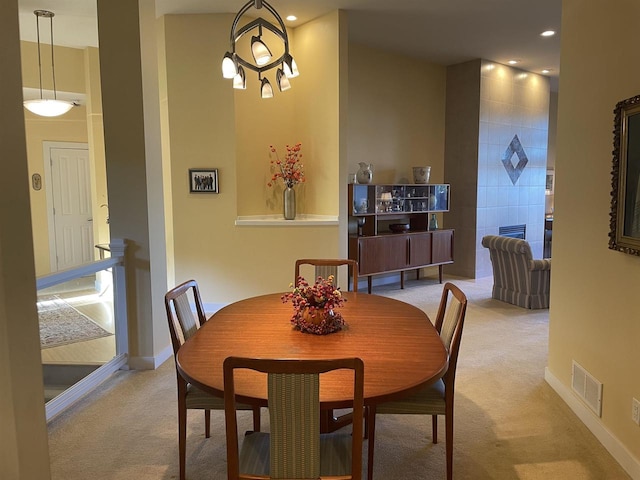 dining room with light colored carpet