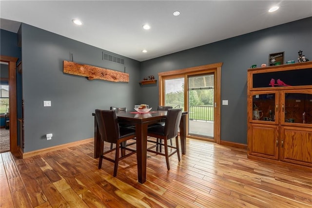 dining room with light hardwood / wood-style flooring