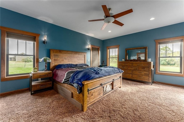 bedroom with ceiling fan and carpet