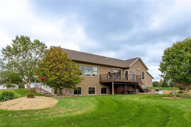 back of house featuring a yard and a wooden deck