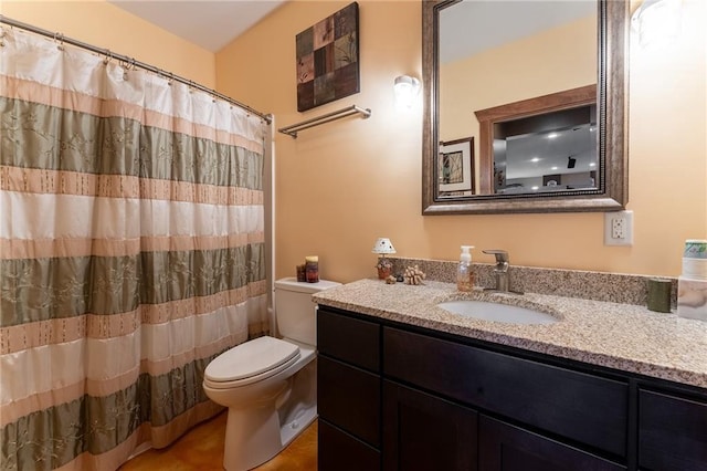 bathroom with vanity, toilet, and a shower with curtain