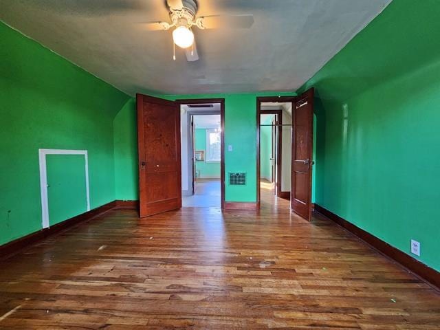 unfurnished bedroom with wood-type flooring and ceiling fan