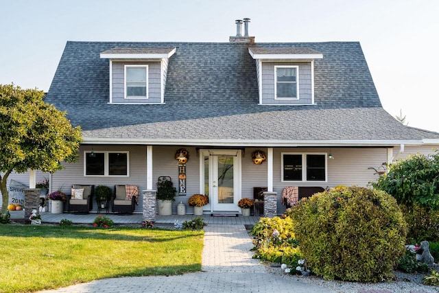 view of front of house with a front lawn and covered porch