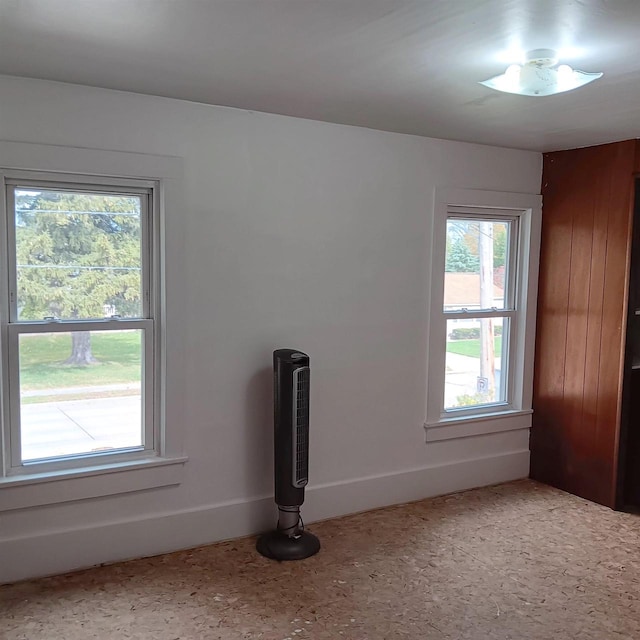 unfurnished room featuring a healthy amount of sunlight