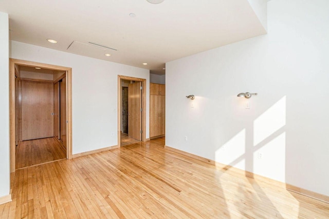 unfurnished room with wood-type flooring