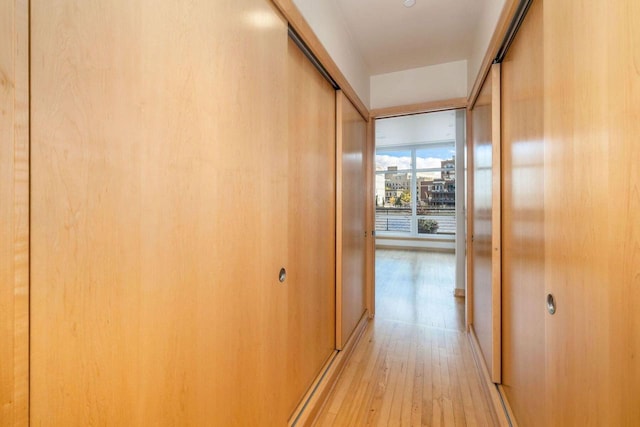 corridor featuring light hardwood / wood-style floors