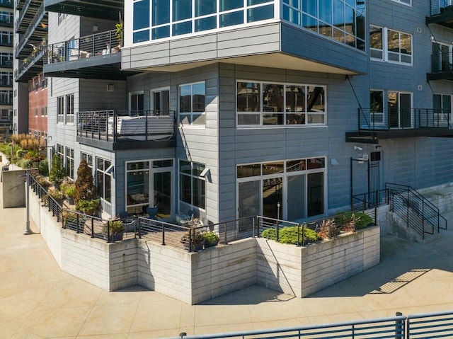 back of house with a balcony