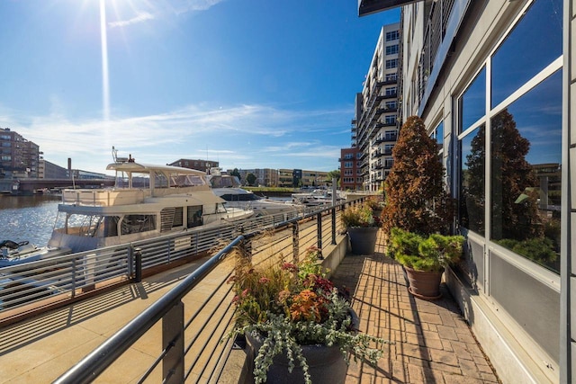 balcony featuring a water view