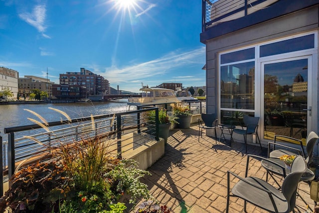 view of patio featuring a water view