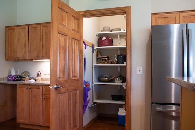 interior space featuring stainless steel fridge