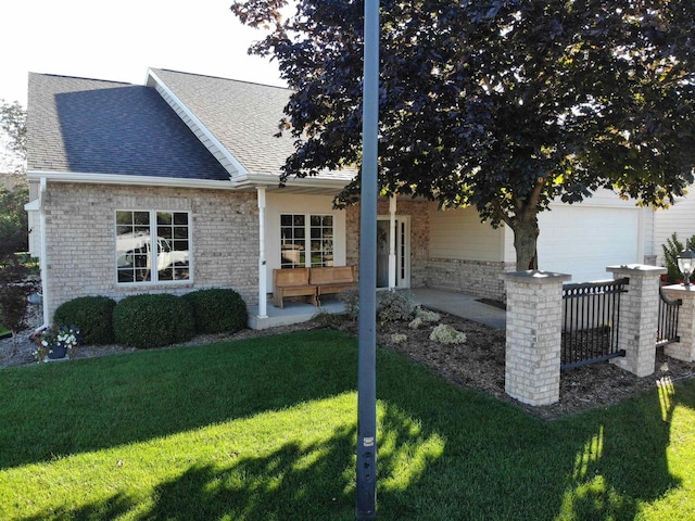 view of side of home with a garage and a lawn