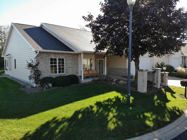 view of front facade with a garage and a front yard