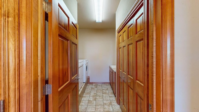 washroom featuring washing machine and clothes dryer