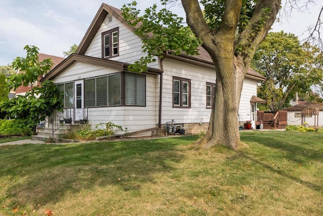 rear view of house with a lawn