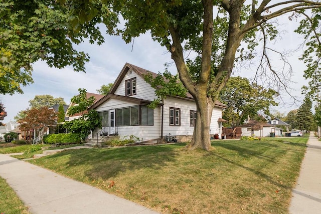 view of front of home with a front lawn