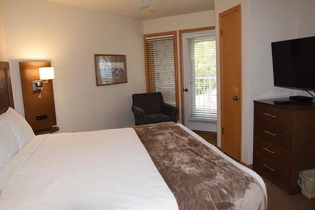 bedroom featuring access to exterior and ceiling fan