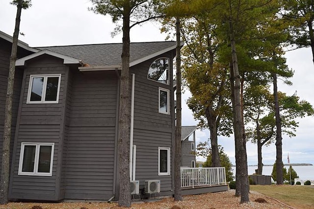 view of side of property with ac unit