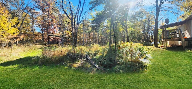 view of yard featuring a wooden deck