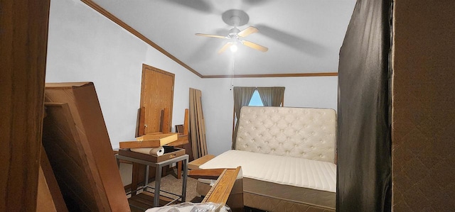 bedroom with ornamental molding, ceiling fan, hardwood / wood-style flooring, and vaulted ceiling