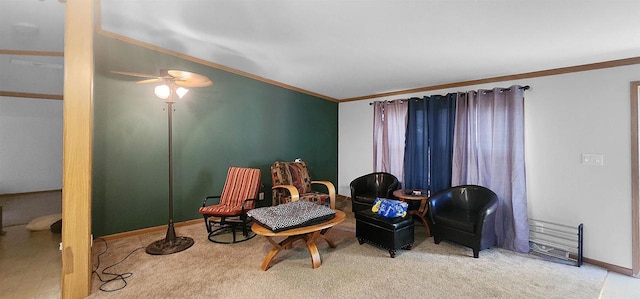 sitting room featuring crown molding and ceiling fan