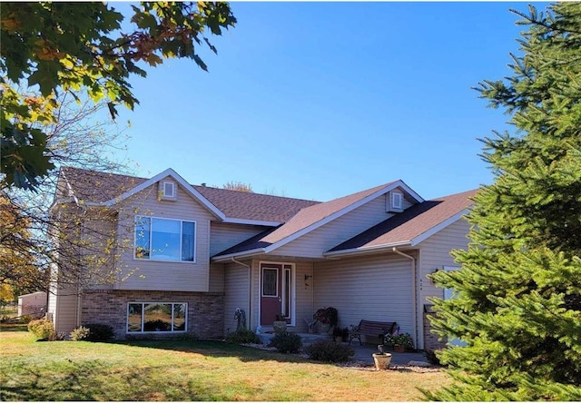 view of front of property with a patio area and a front yard