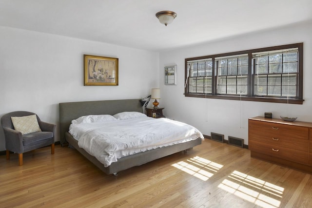 bedroom with light hardwood / wood-style floors