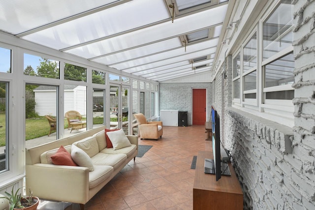 sunroom / solarium with lofted ceiling and a healthy amount of sunlight