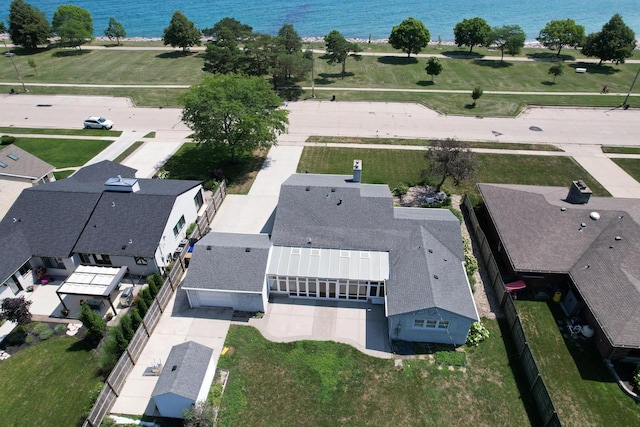 birds eye view of property with a water view