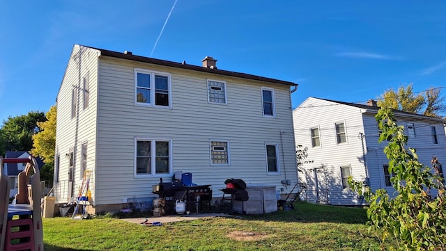 back of house with a yard