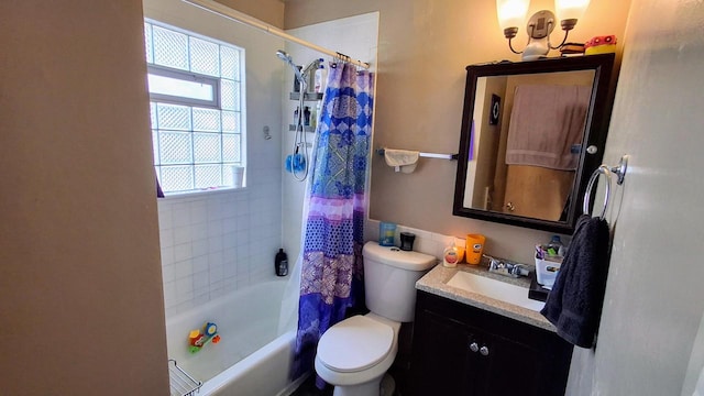 full bathroom with vanity, shower / bath combo, and toilet