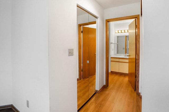 corridor featuring light hardwood / wood-style floors